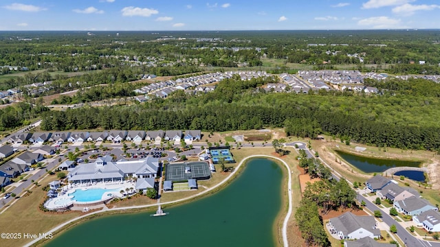 drone / aerial view with a residential view and a water view