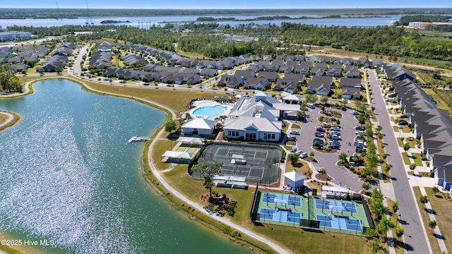 birds eye view of property with a water view and a residential view