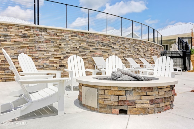 view of patio / terrace with a fire pit