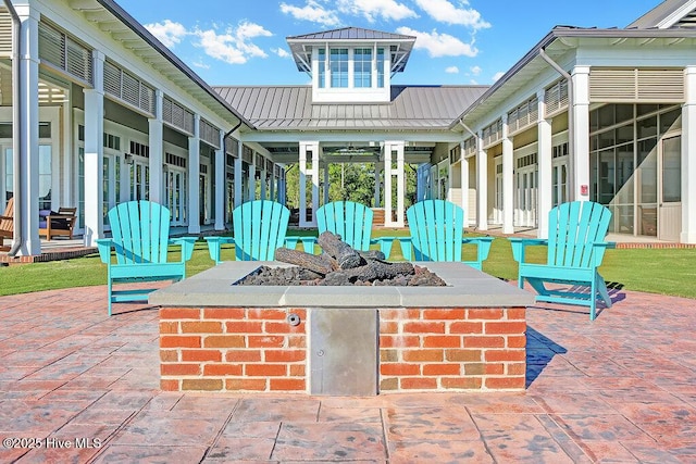 view of patio with an outdoor fire pit