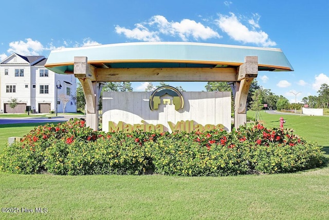 community sign with a lawn