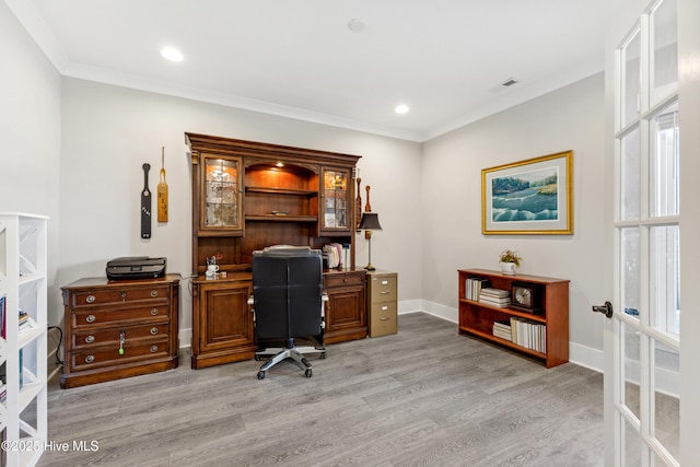 office featuring visible vents, ornamental molding, baseboards, recessed lighting, and light wood finished floors