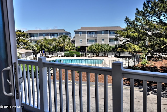 pool with fence and a patio area