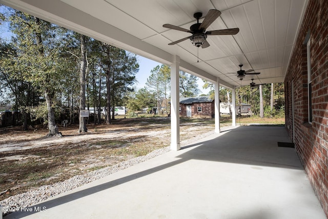 view of patio / terrace featuring an outdoor structure and ceiling fan