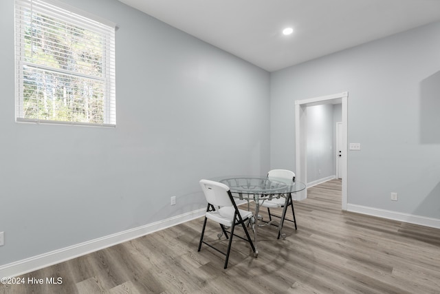 dining area with recessed lighting, baseboards, and wood finished floors