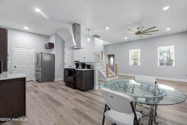 kitchen with visible vents, dark brown cabinets, ventilation hood, freestanding refrigerator, and black range with electric cooktop