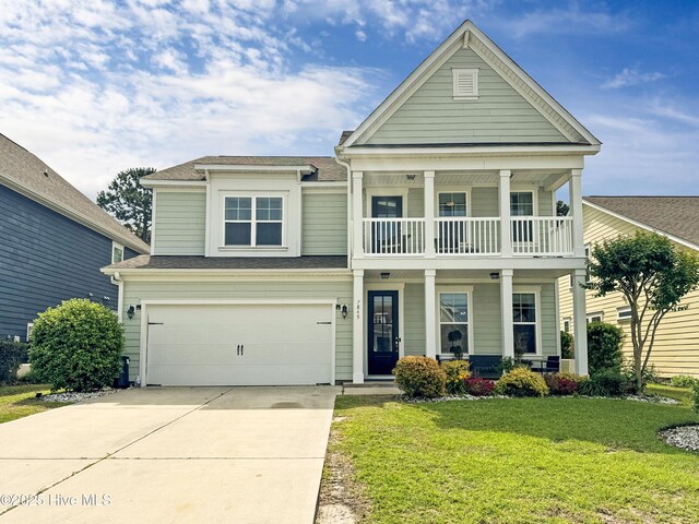 7845 Champlain Dr, Wilmington, NC 28412 - view of front of property featuring a porch, driveway, a front yard, a balcony, and an attached garage
