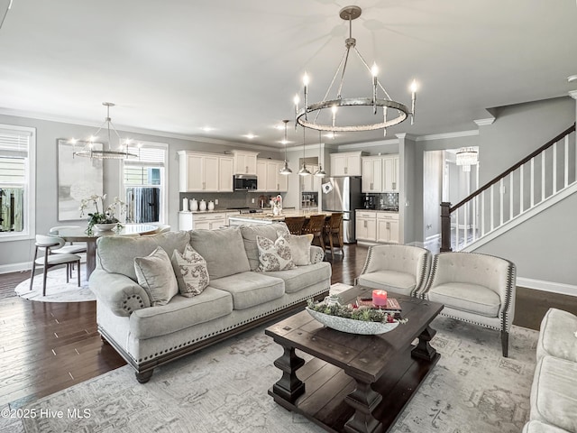 7845 Champlain Dr, Wilmington, NC 28412 - living area with baseboards, ornamental molding, dark wood finished floors, and a chandelier