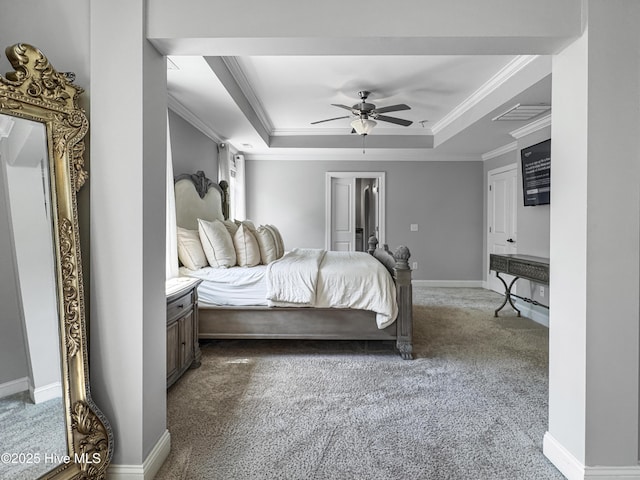 7845 Champlain Dr, Wilmington, NC 28412 - carpeted bedroom with baseboards, ornamental molding, a raised ceiling, and a ceiling fan