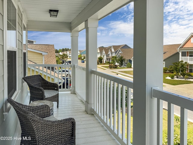 7845 Champlain Dr, Wilmington, NC 28412 - balcony featuring a porch and a residential view
