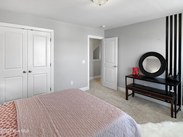 7845 Champlain Dr, Wilmington, NC 28412 - bedroom with baseboards, light carpet, and a closet
