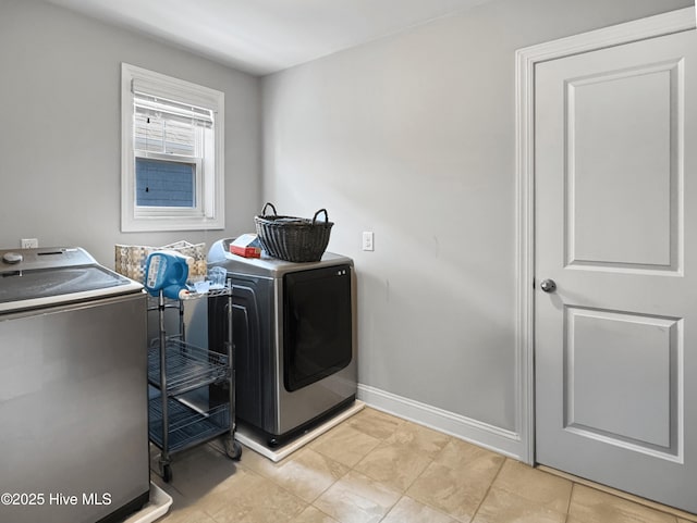 7845 Champlain Dr, Wilmington, NC 28412 - laundry area featuring baseboards, laundry area, and washer and clothes dryer