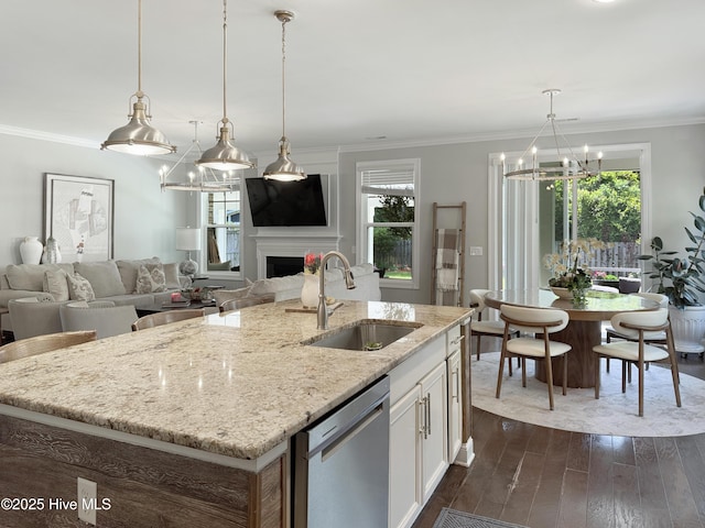 7845 Champlain Dr, Wilmington, NC 28412 - kitchen featuring stainless steel dishwasher, a sink, open floor plan, and an inviting chandelier