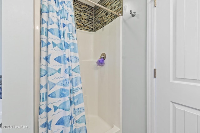bathroom with a shower with curtain