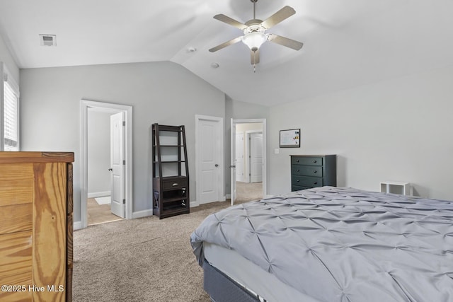 carpeted bedroom featuring baseboards, ceiling fan, and vaulted ceiling
