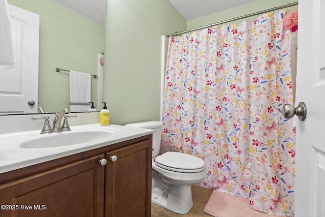 bathroom with vanity, tile patterned flooring, toilet, and curtained shower