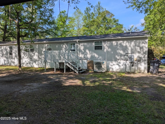 back of property featuring stairs, ac unit, and a deck