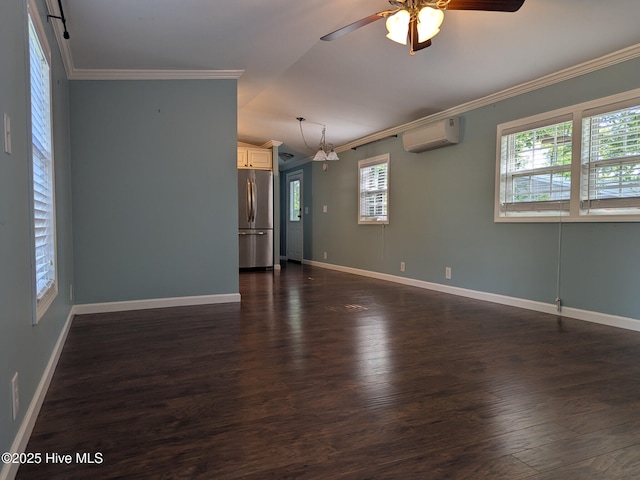 empty room featuring crown molding, a wall mounted air conditioner, dark wood-style floors, a ceiling fan, and vaulted ceiling