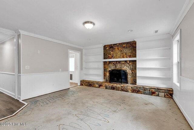 14 Palmer Dr, Shallotte, NC 28470 - unfurnished living room featuring crown molding, built in features, and a stone fireplace