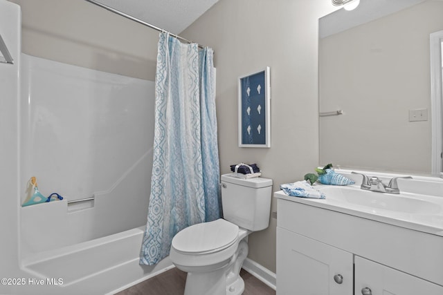 full bath with toilet, wood finished floors, shower / tub combo, and vanity
