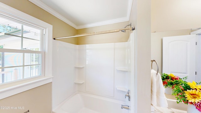 full bathroom featuring crown molding and bathing tub / shower combination