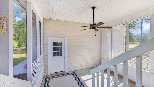 property entrance with a ceiling fan