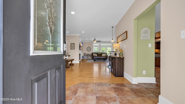 foyer entrance featuring a ceiling fan, baseboards, recessed lighting, and wood finished floors