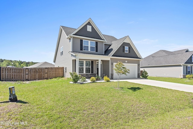 view of front facade featuring fence, stone siding, driveway, and a front yard