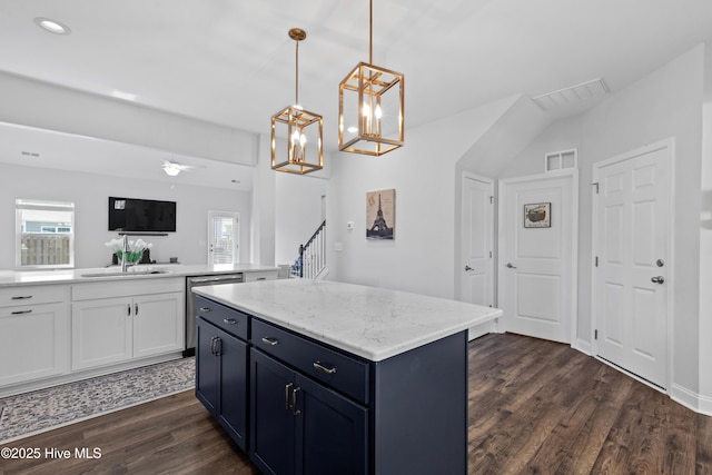 kitchen featuring dark wood-style flooring, visible vents, a wealth of natural light, and dishwasher