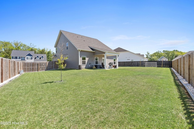 view of yard featuring a fenced backyard