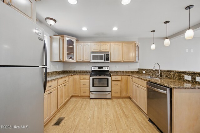 902 Hunnicutt Ave, Elizabeth City, NC 27909 - kitchen with a sink, stainless steel appliances, light brown cabinetry, and visible vents