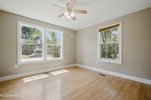 902 Hunnicutt Ave, Elizabeth City, NC 27909 - unfurnished room with a wealth of natural light, light wood finished floors, and visible vents