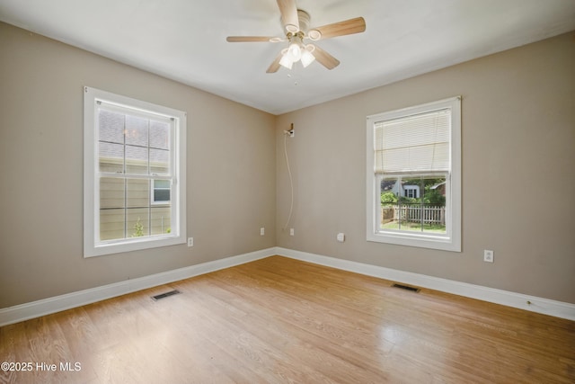 902 Hunnicutt Ave, Elizabeth City, NC 27909 - spare room with light wood-type flooring, ceiling fan, baseboards, and visible vents