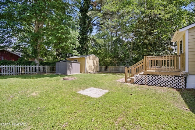902 Hunnicutt Ave, Elizabeth City, NC 27909 - view of yard with a deck, an outbuilding, a shed, and a fenced backyard