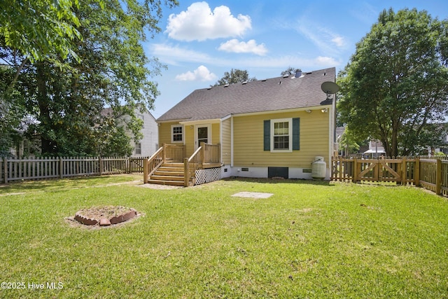 902 Hunnicutt Ave, Elizabeth City, NC 27909 - rear view of house with a yard, roof with shingles, a fenced backyard, and crawl space
