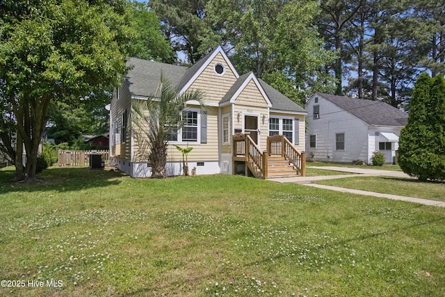 902 Hunnicutt Ave, Elizabeth City, NC 27909 - bungalow-style home with central air condition unit, roof with shingles, a front yard, and crawl space