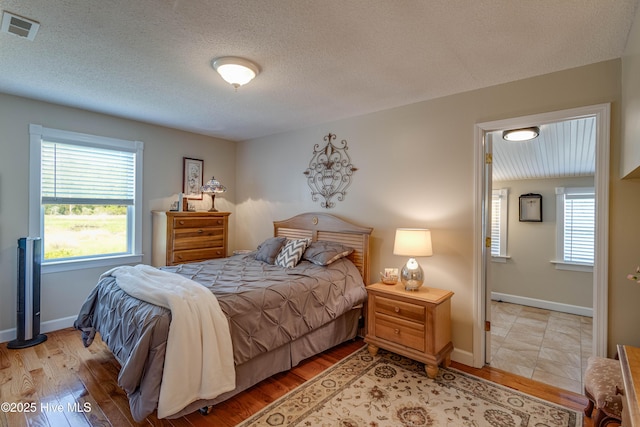 966 W Island View Rd, Bath, NC 27808 - bedroom featuring visible vents, light wood finished floors, and baseboards