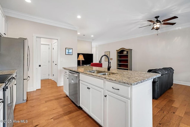 102 SW 8th St, Oak Island, NC 28465 - kitchen with a sink, crown molding, stainless steel appliances, and open floor plan