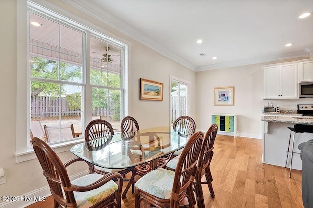 102 SW 8th St, Oak Island, NC 28465 - dining room featuring crown molding, recessed lighting, baseboards, and light wood-type flooring