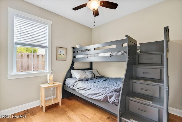 102 SW 8th St, Oak Island, NC 28465 - bedroom with baseboards and light wood-style floors
