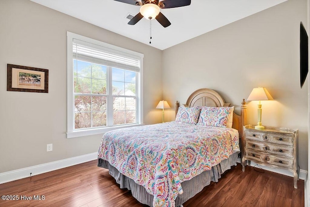 102 SW 8th St, Oak Island, NC 28465 - bedroom with baseboards, ceiling fan, and wood finished floors
