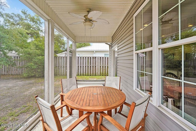 102 SW 8th St, Oak Island, NC 28465 - sunroom / solarium featuring ceiling fan and outdoor dining area
