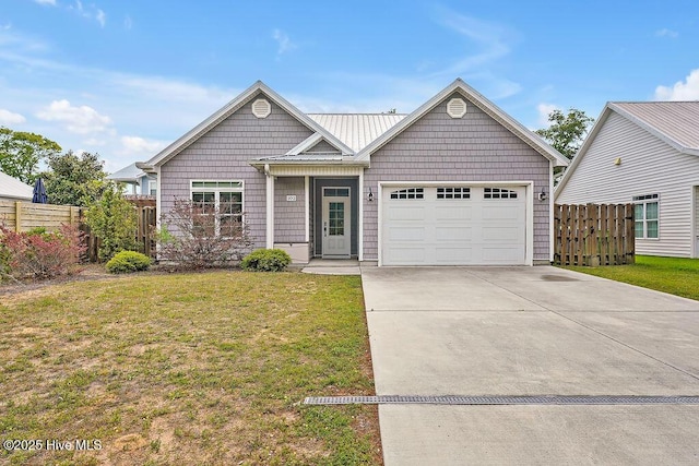 102 SW 8th St, Oak Island, NC 28465 - ranch-style house featuring fence, an attached garage, driveway, and a front yard