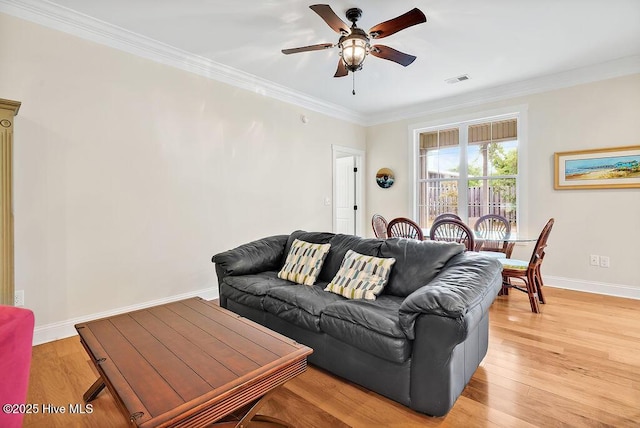 102 SW 8th St, Oak Island, NC 28465 - living area with baseboards, crown molding, light wood-style flooring, and ceiling fan