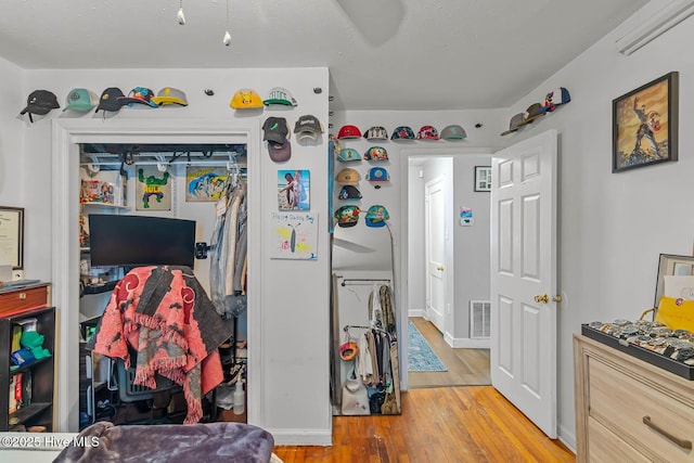 kitchen with visible vents and hardwood / wood-style floors