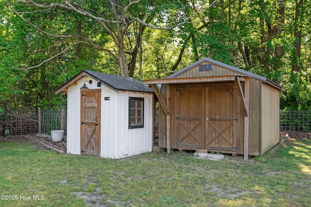 view of shed with fence