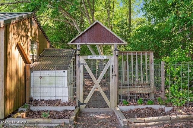 view of gate featuring fence