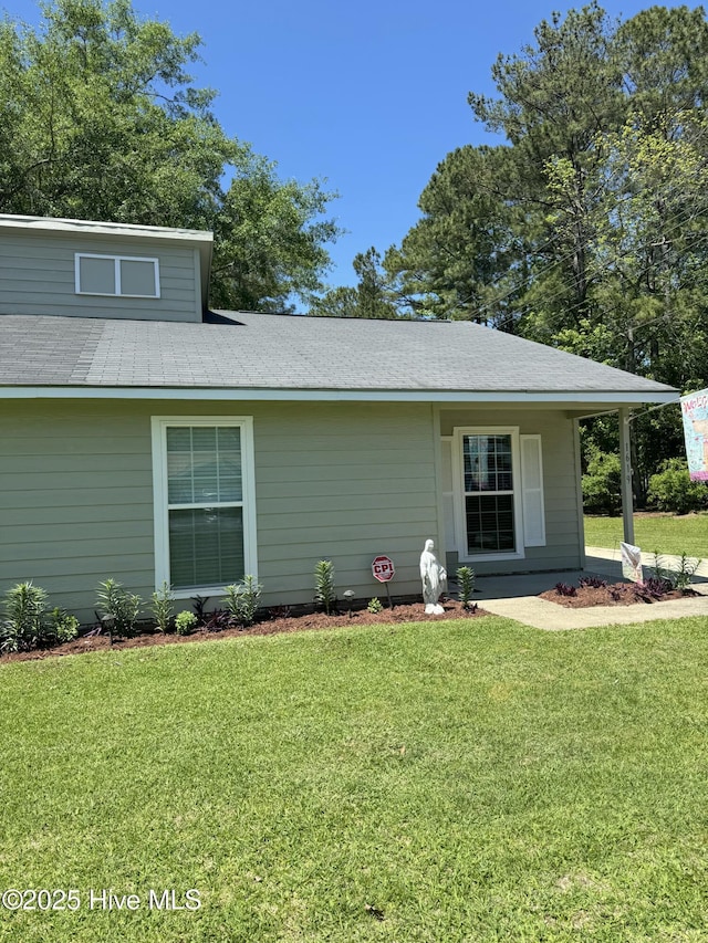 exterior space with a yard