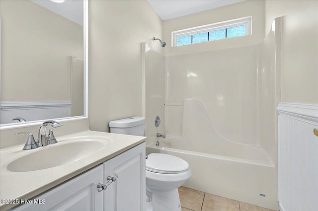 bathroom with vanity, tub / shower combination, tile patterned floors, and toilet