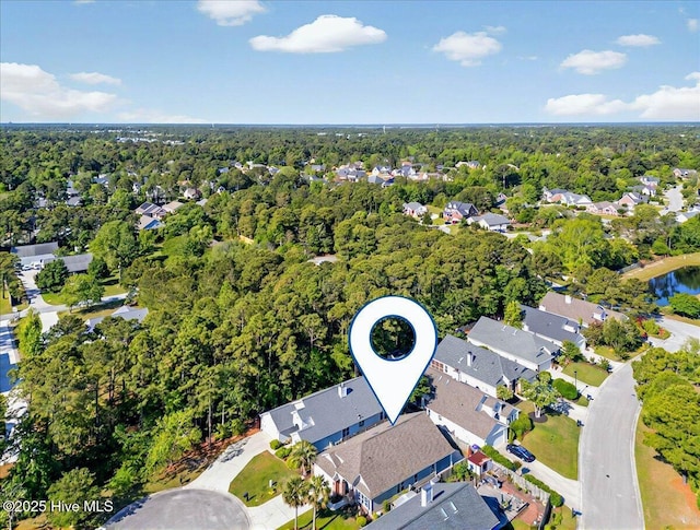 birds eye view of property with a residential view and a view of trees